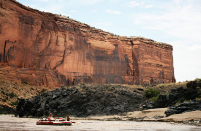 raft floating on the Colorado River in Westwater Canyon