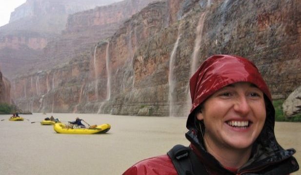 rafters enjoying rain on a grand canyon rafting trip