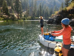 women showing what to wear whitewater rafting in camp