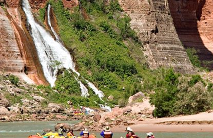 rafts on Colorado River with Vaseys Paradise in the background