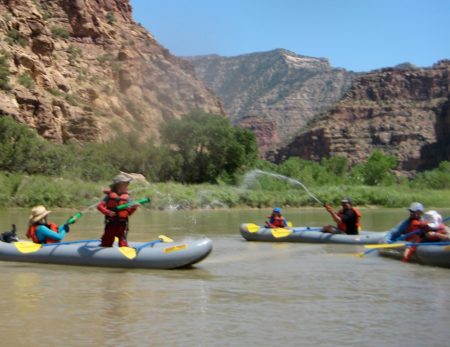 inflatable kayak water fighting in desolation canyon