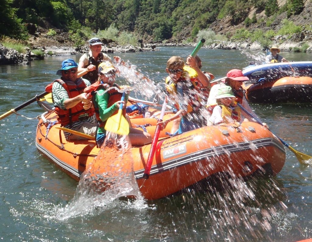 family water fighting on the Rogue River Family Rafting trip