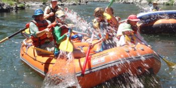 family water fighting on the Rogue River Family Rafting trip