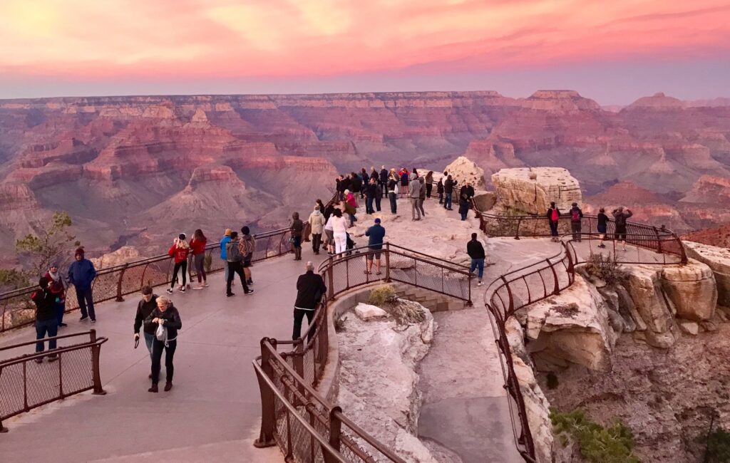 Grand Canyon Rim trail overlook with hikers