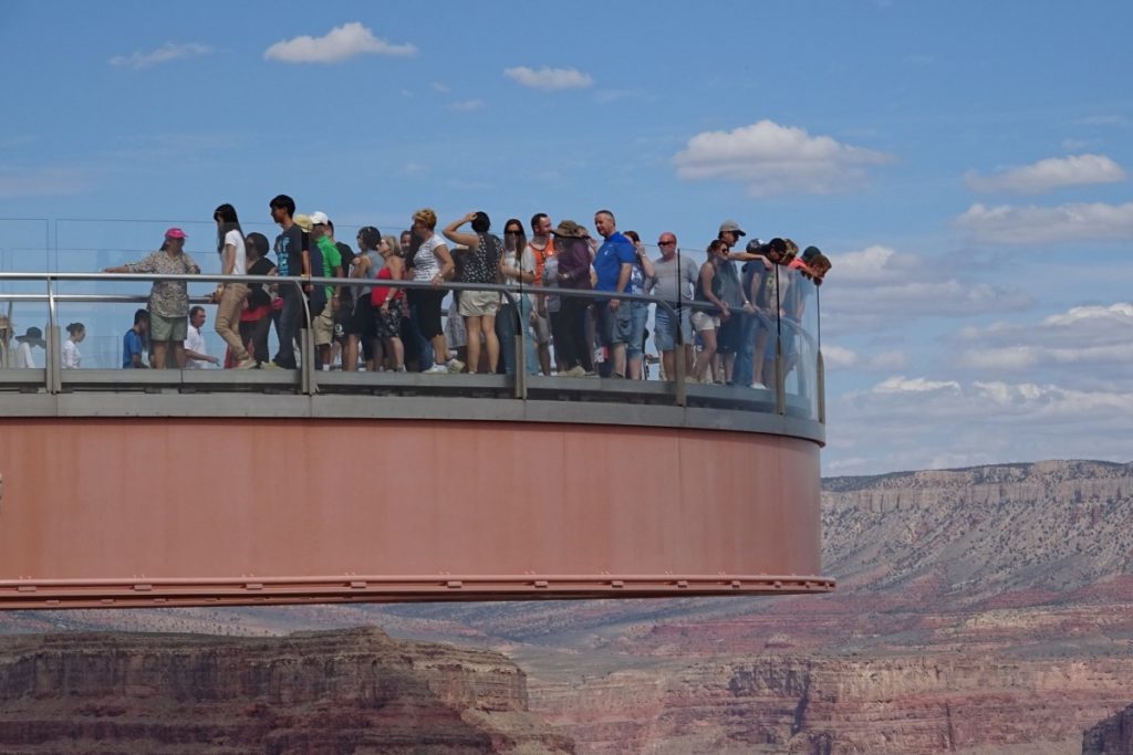 People standing on glass bridge of the Skywalk in Grand Canyon