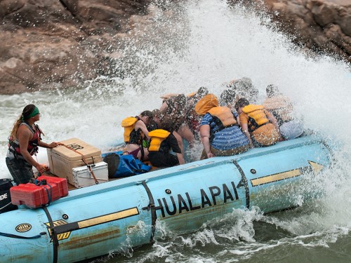 motorized raft in white water rapid