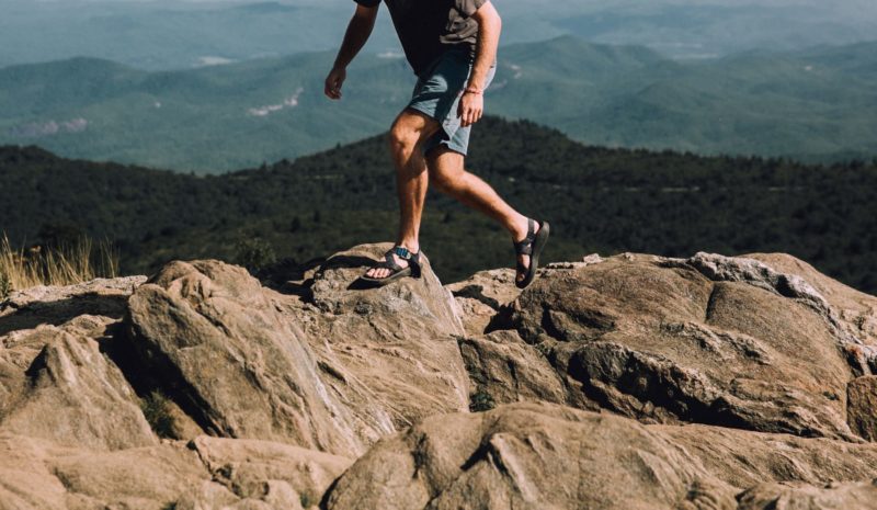 men walking on rocks in Grand Canyon rafting sandals