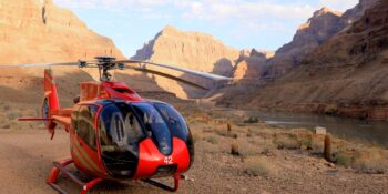 helicopter sitting above a Colorado River rafting trip in Grand Canyon