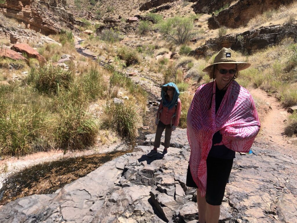 hikers wearing sarongs and hats for sun protection