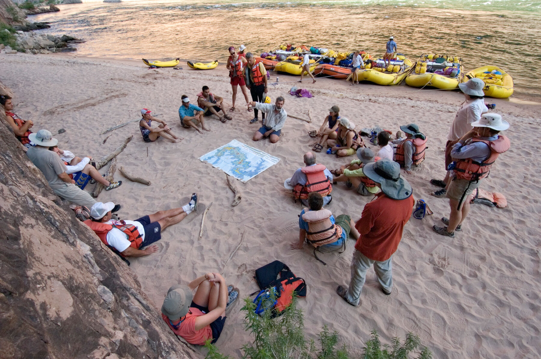 guide reading a Grand Canyon rafting book