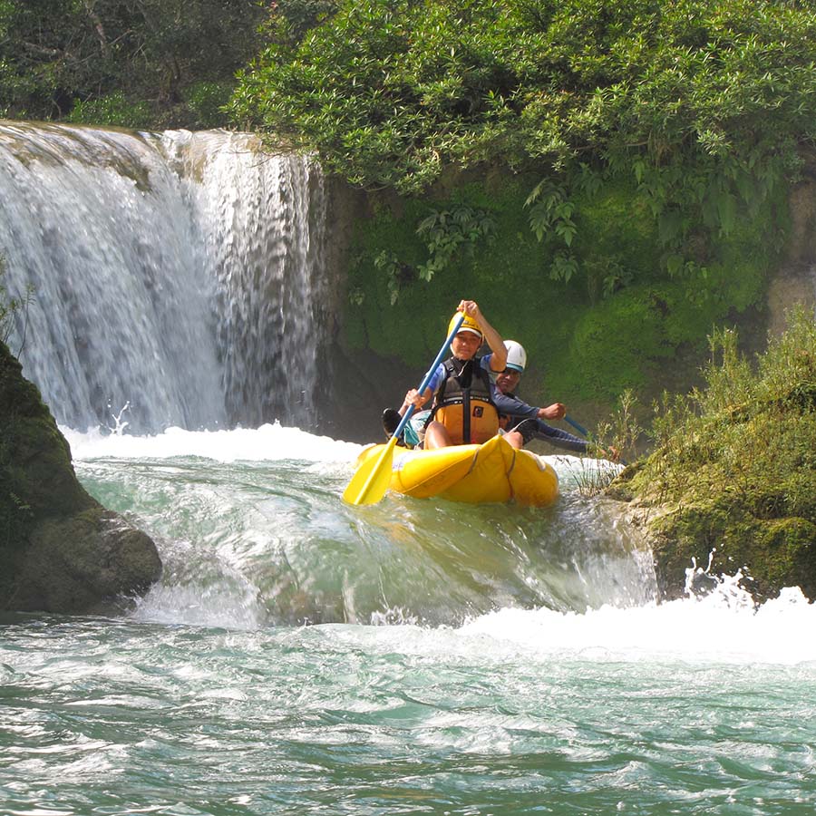inflatable kayak running Moho River in Belize