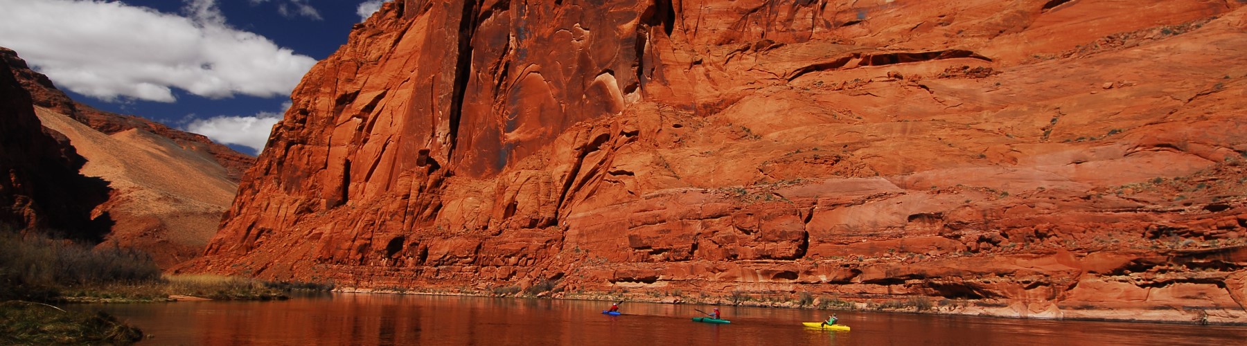 kayakers paddling Colorado River through Horseshoe Bend