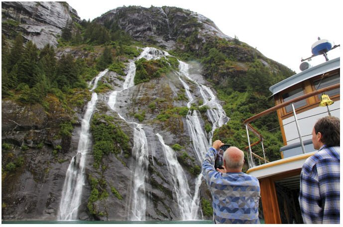 Alaskan Small Ship Cruise in fjords viewing a waterfall