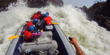 raft running big rapid on international rafting trip