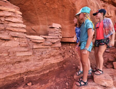 kids looking at ruins in Cataract Canyon