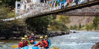rafters going under bridge on the Paro Chhu (River)