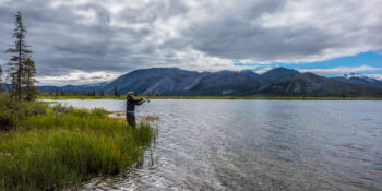 Angler casting on calm water in ANWR